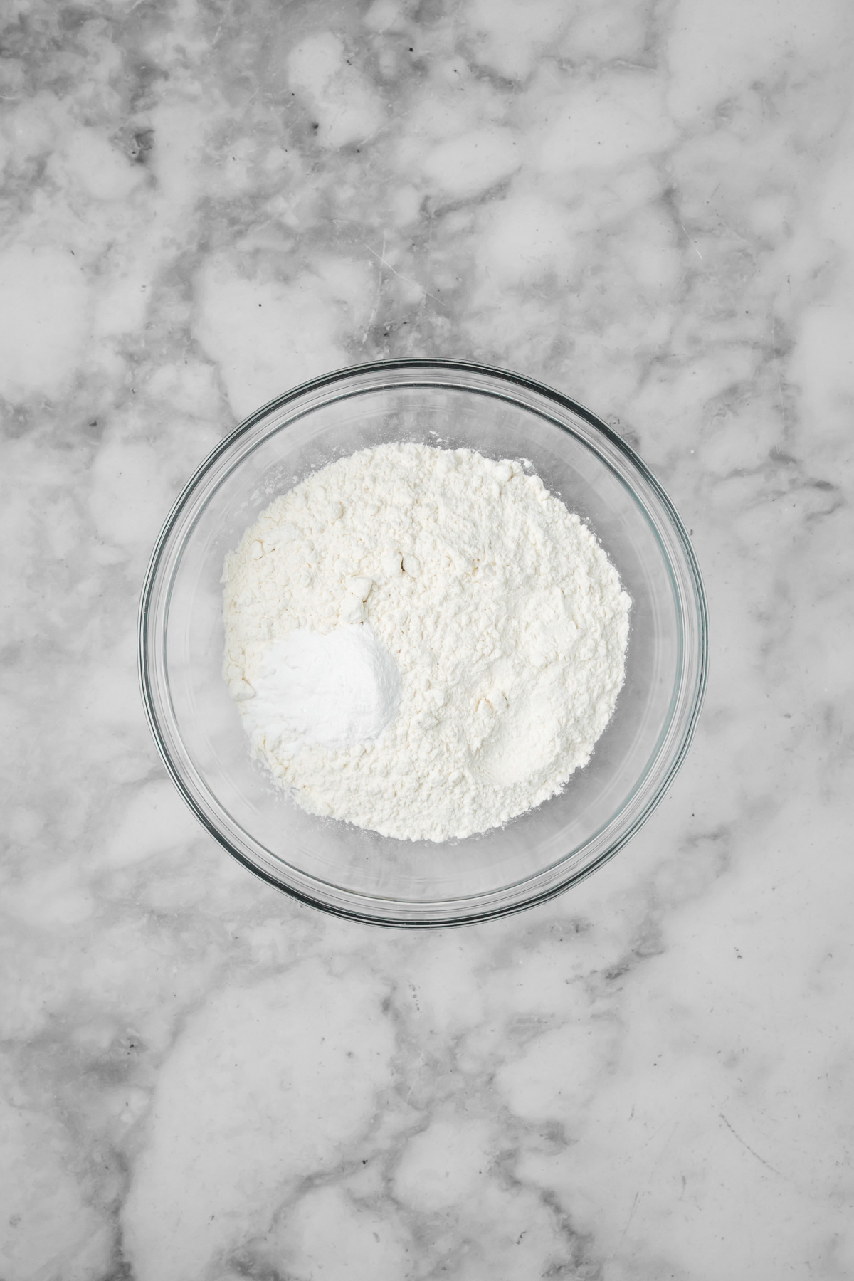 Dry ingredients in a glass bowl.