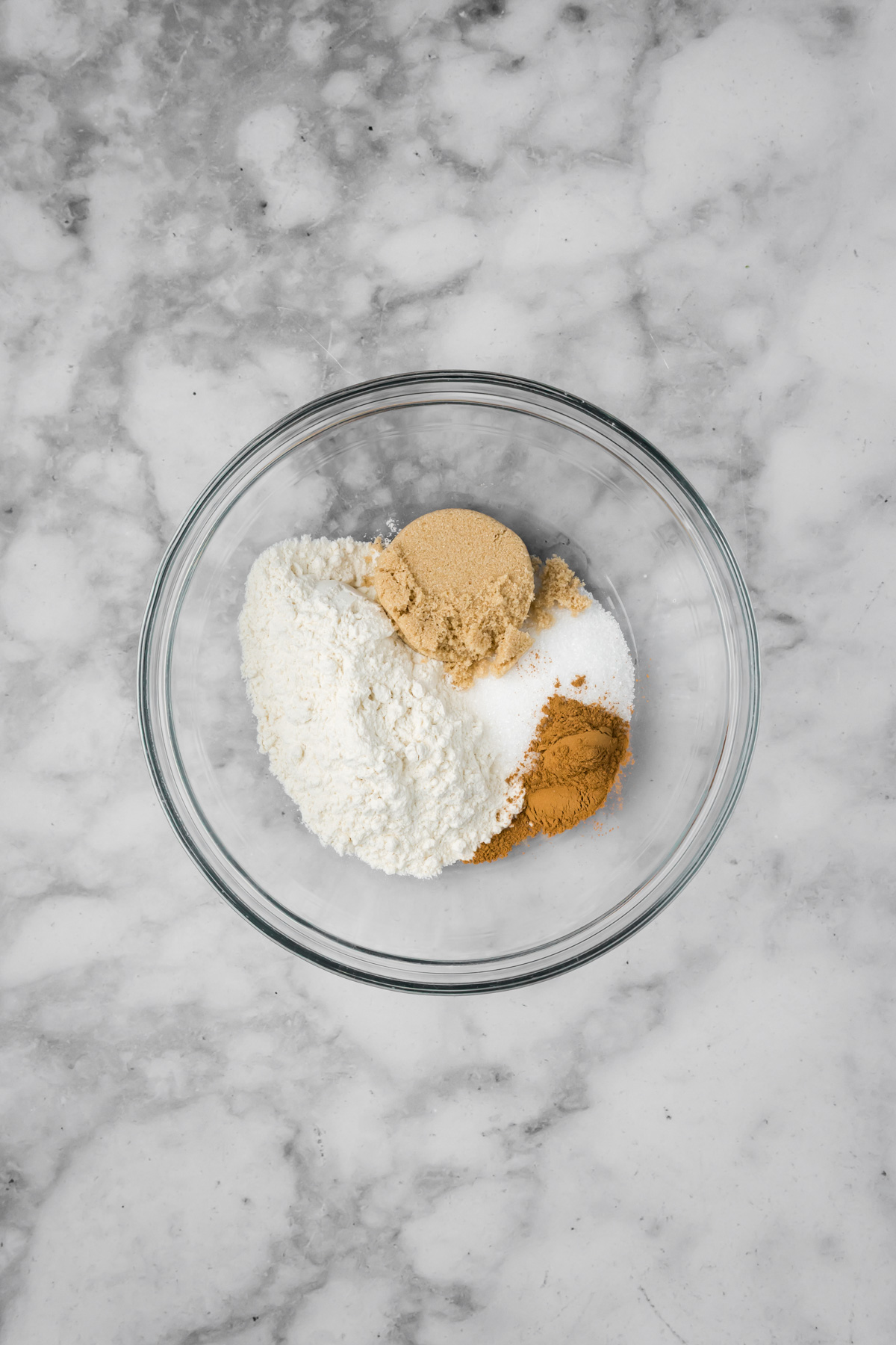 Ingredients for the streusel in a glass bowl.