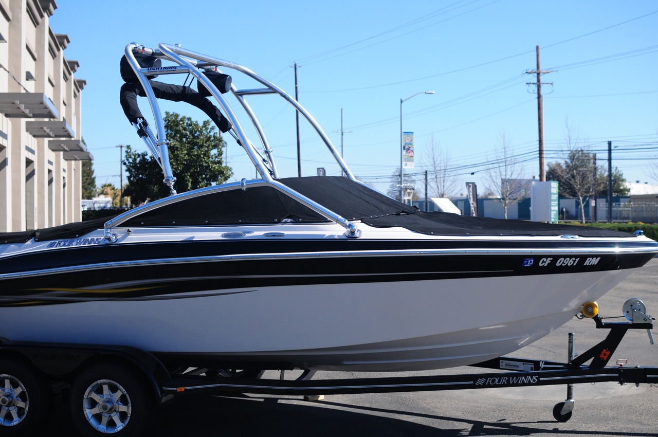 Four Winns Boat with Custom Tower and Bimini Top Lightning Wakeboard