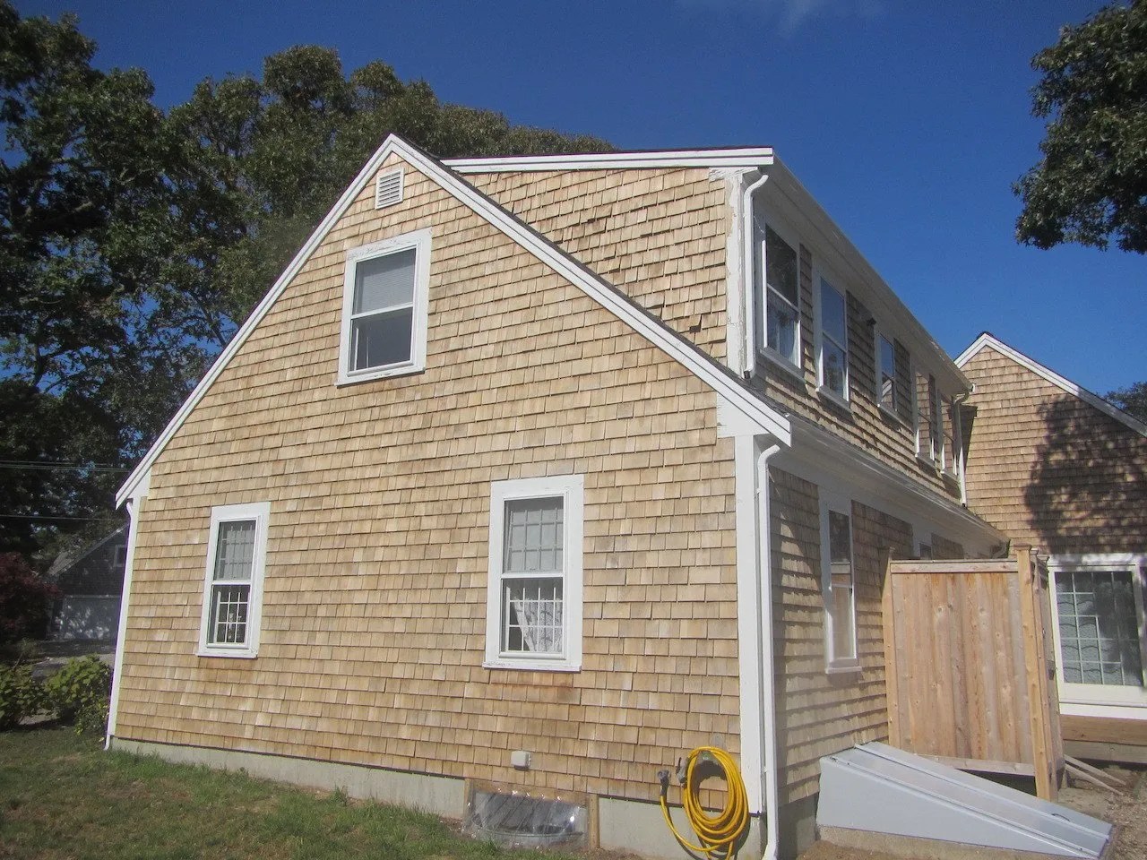 Cleaning cedar shingled siding on Cape Cod