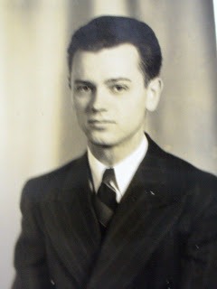 Young Lester Howard in dark suit.