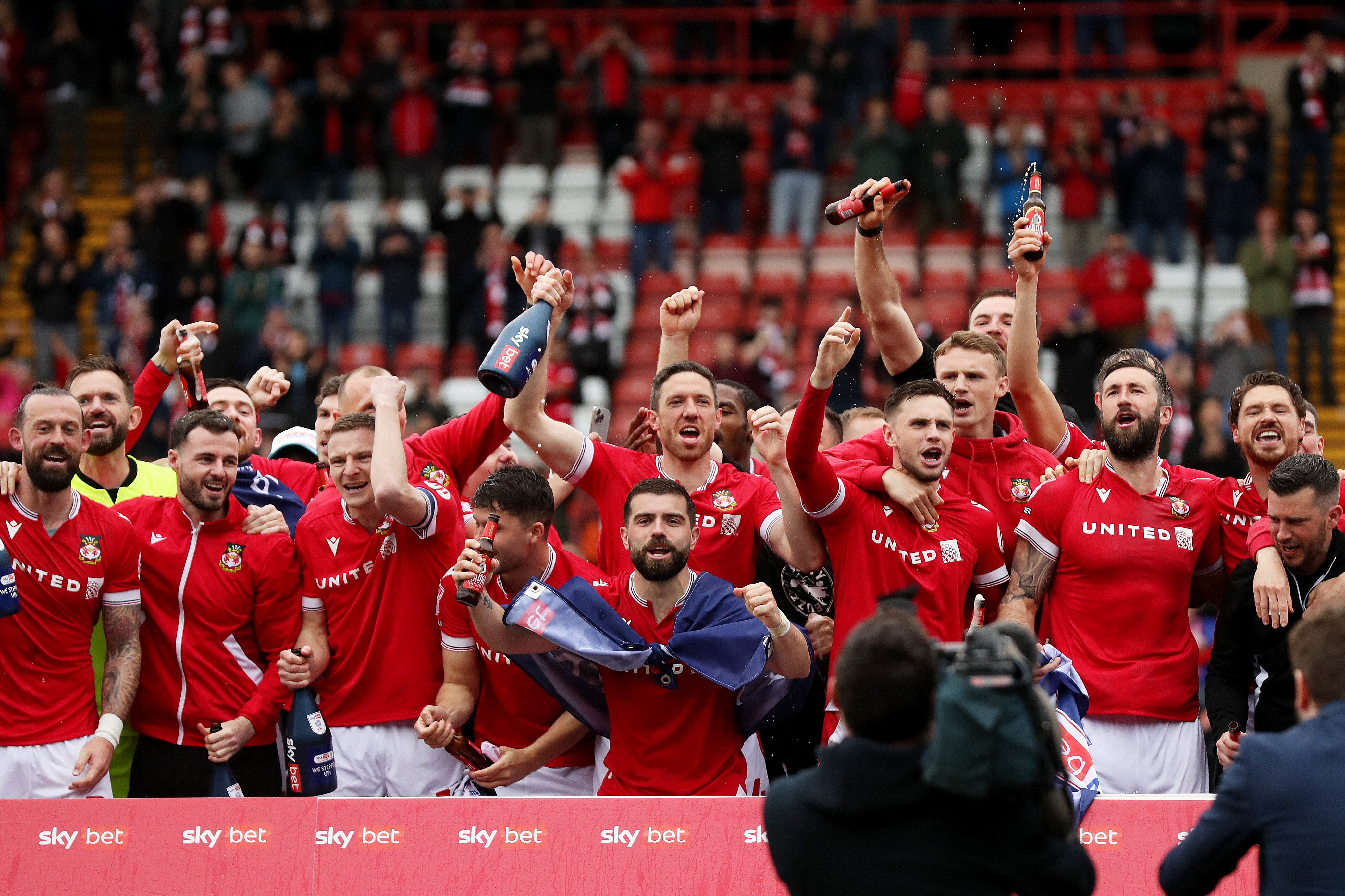 Co-owner Ryan Reynolds celebrates Wrexham promotion to third-tier as Welsh club seals rise from League Two