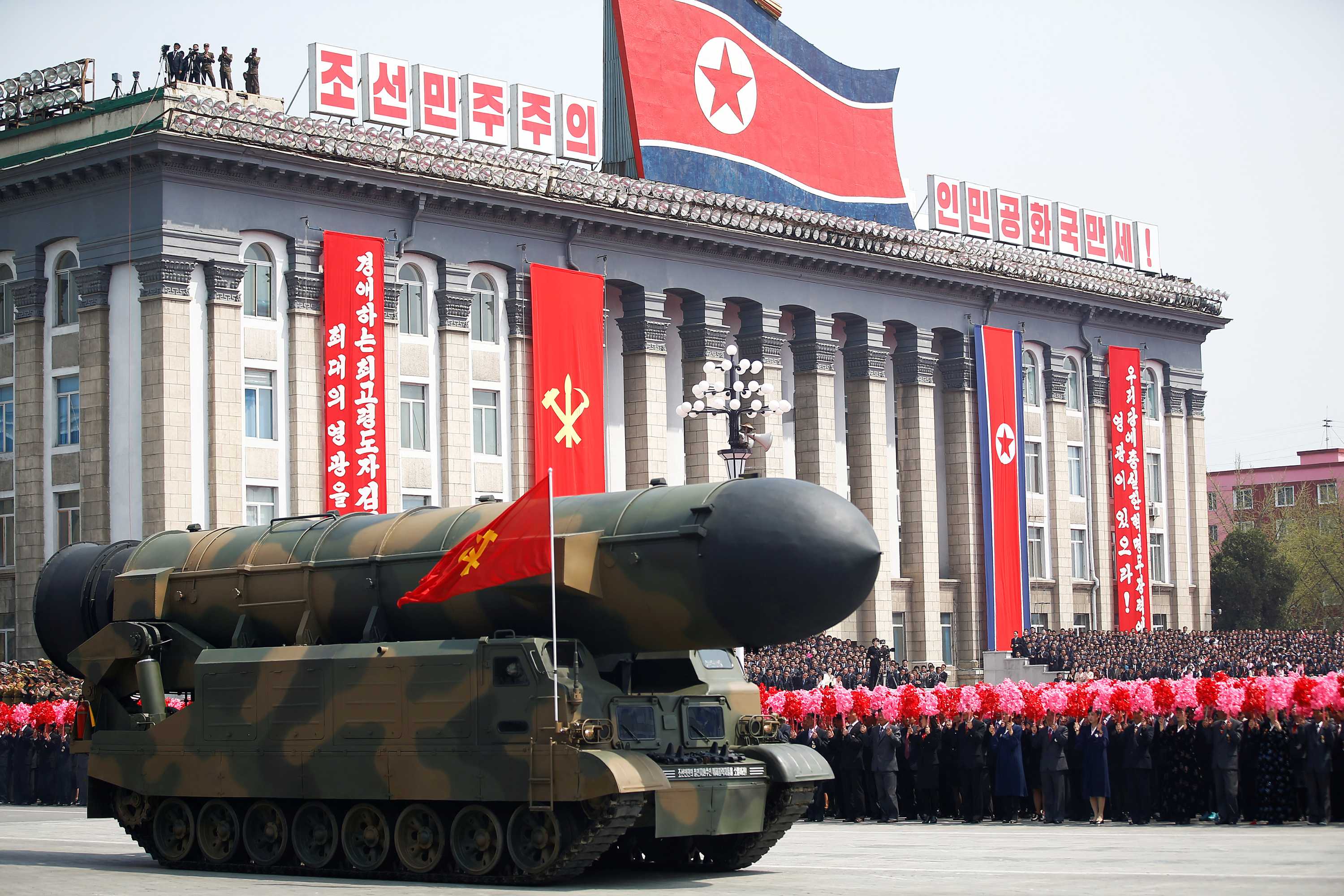 North Korea parades missiles as Kim Jongun aide threatens US with