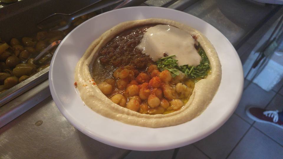 Israeli hummus cafe offers half price meals to Jews and Arabs who eat