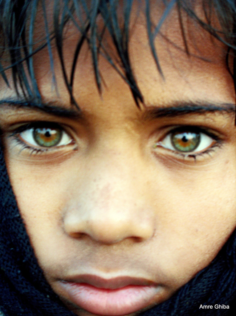 Greeneyed indian boy during Ardh Kumbh Mela The most beautiful eyes
