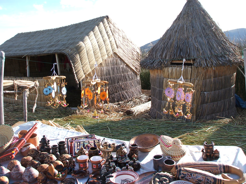 Lake Titicaca, Uros, Artifacts for sale, Homes in the back… Flickr