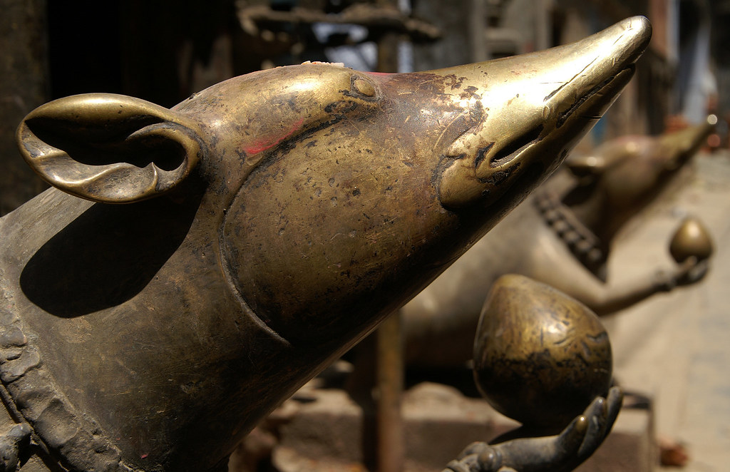 Bronze Rats Two statues of RatGods that are holding bronz… Flickr