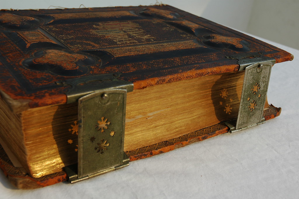 The Holy Bible, gold pages from the side, with metal clasp… Flickr