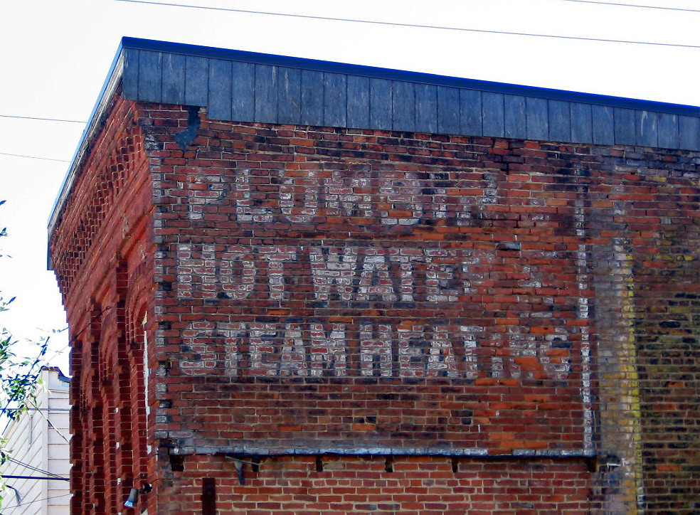 Plumbing, hot water, steam heating ghost sign in Decorah,… Flickr