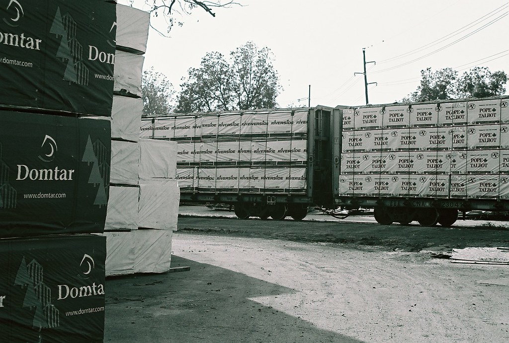 austin_lumber_yard lumber on rail car,photo of yellow pine… Flickr