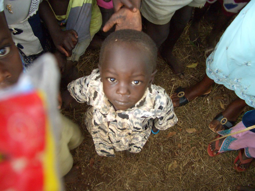 Small orphan boy Orphan ourside of a school being built in… Flickr