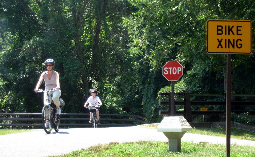 Bike Xing A mother and son bike up the trail in Rock Creek… Flickr