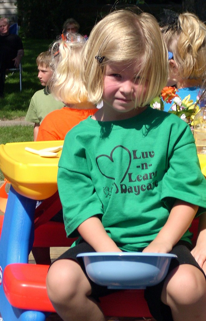 Throwing candy at the Labor Day Parade...and taking her jo… Flickr