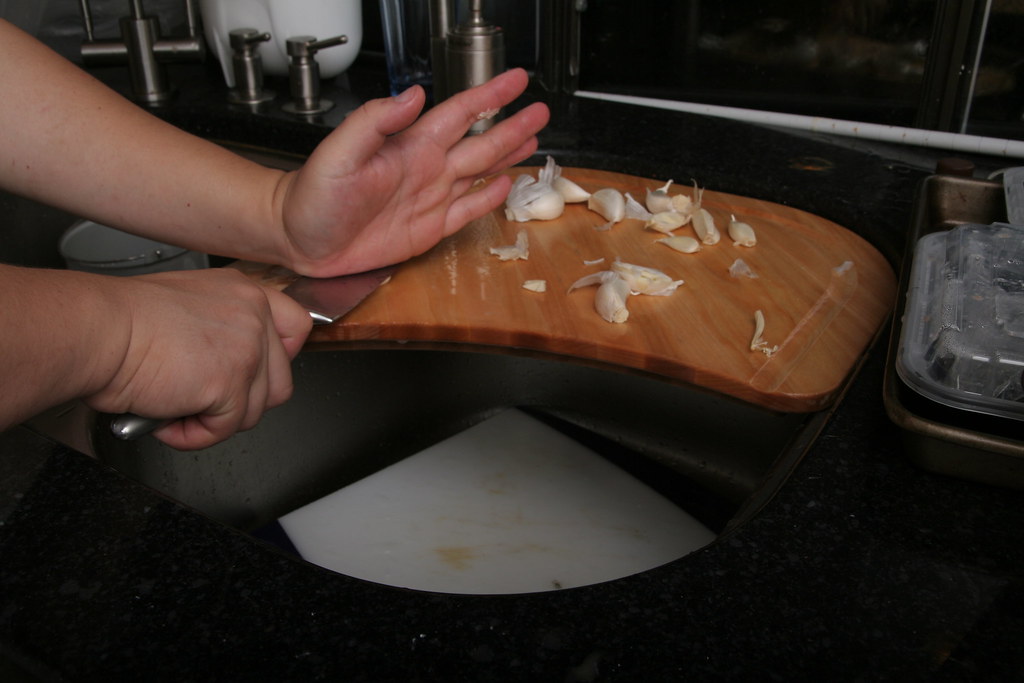 Working w/ Garlic Then I whack the knife blade with the pa… Flickr