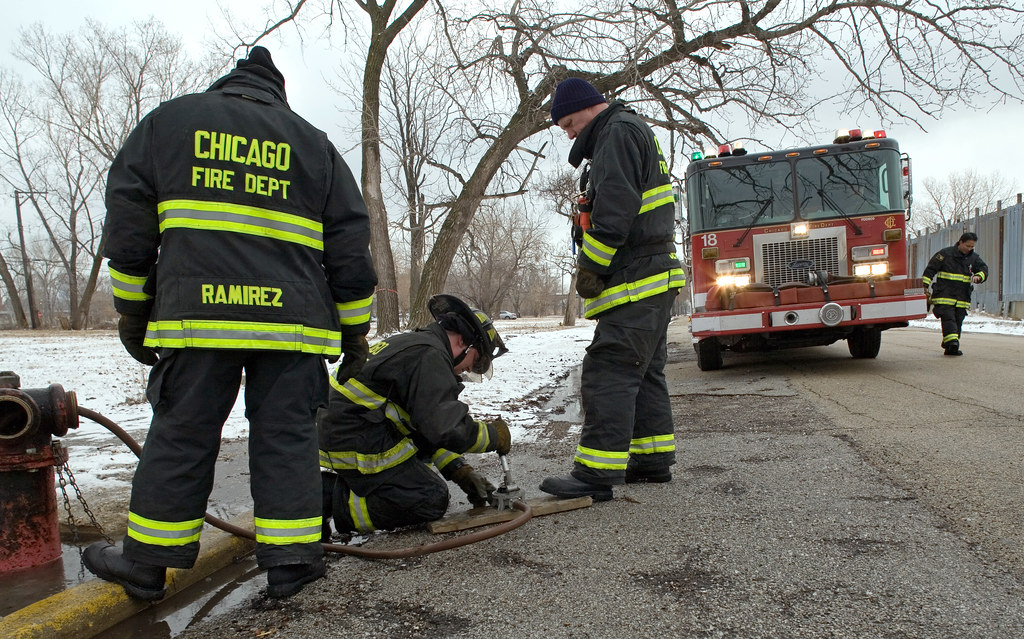 Firefighters Manually Draining Fire Hydrant The firefighte… Flickr
