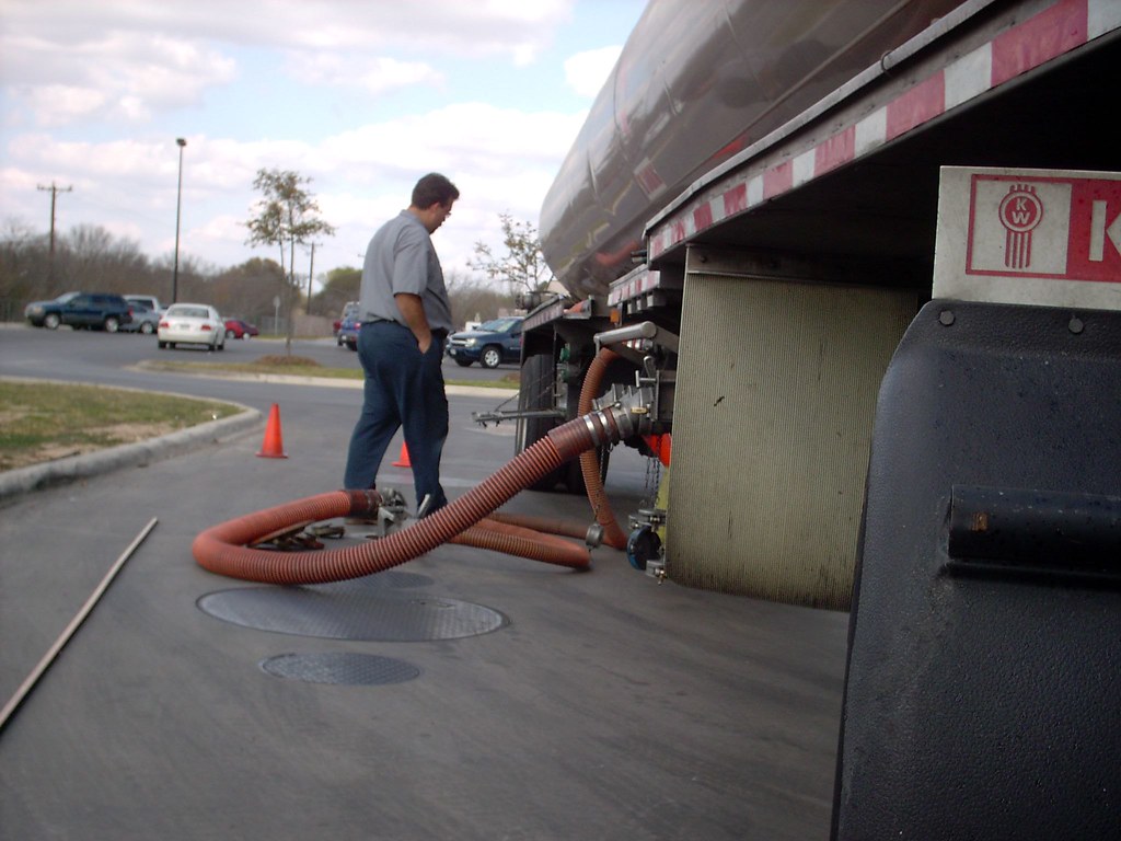 fuel delivery driver short hosing it Daniel Olinick Flickr