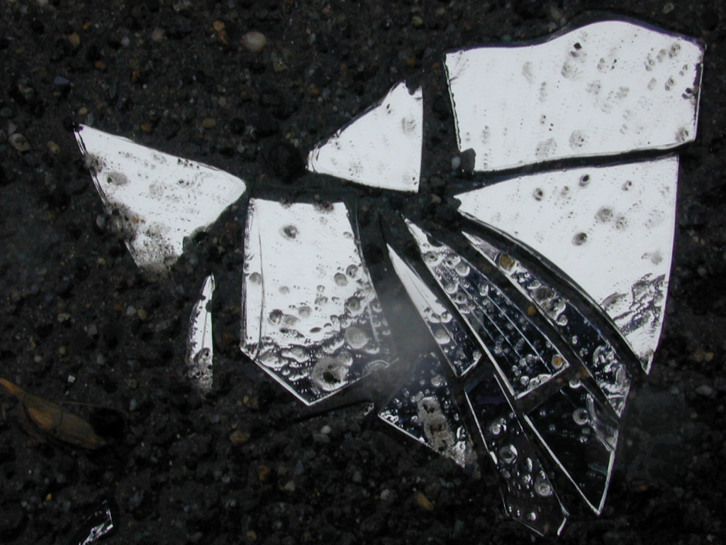 Broken Mirror A broken mirror on the side of the road Greg Sampson