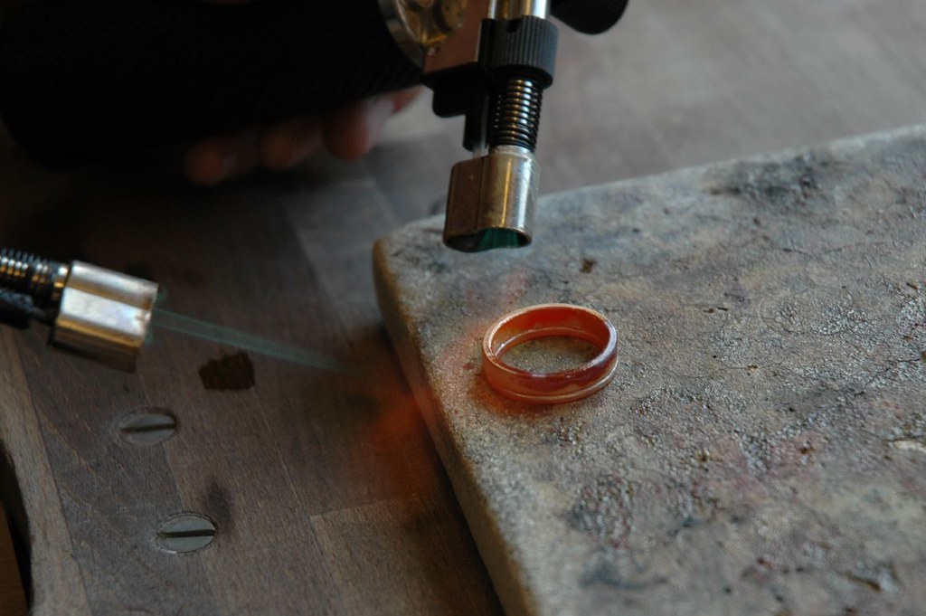soldering the two gold rings together Our rings consist of… Flickr