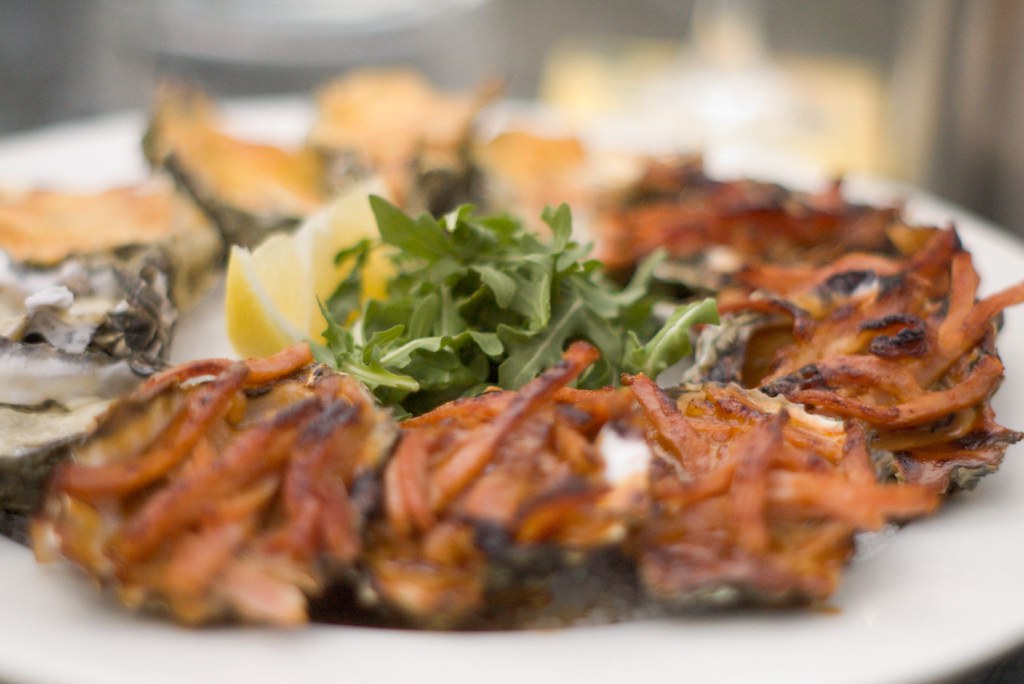 Platter of oysters mix of Oysters Kilpatrick, Mornay and… Flickr