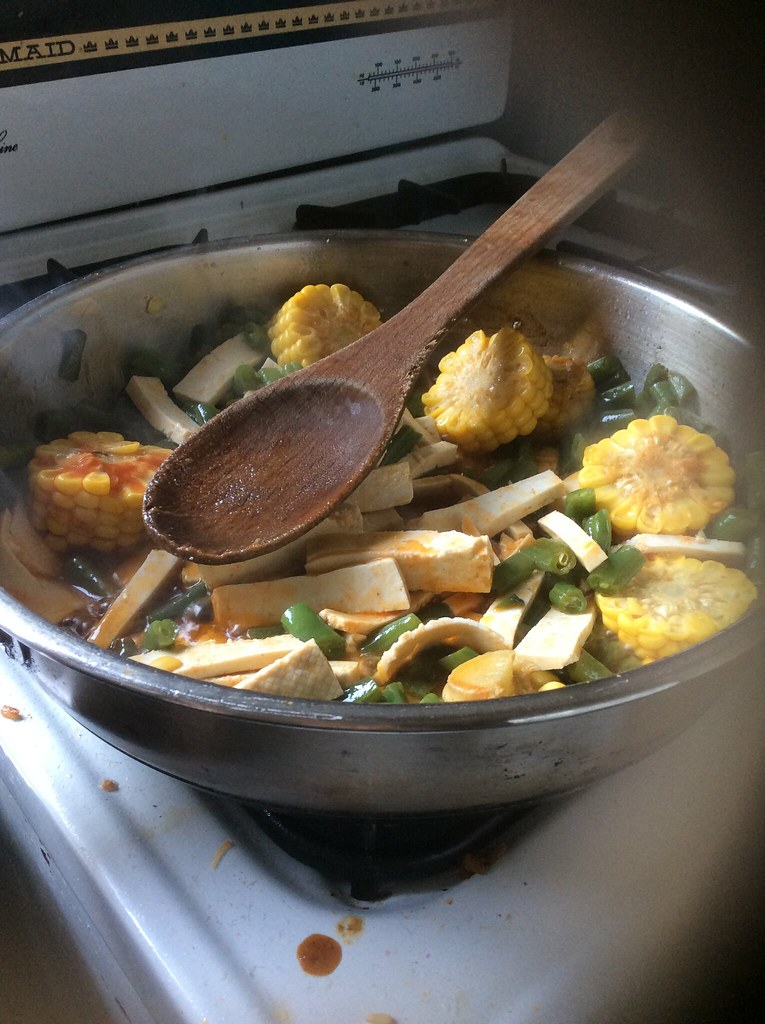 Making fried rice with green beans, corn and tofu David Jackmanson