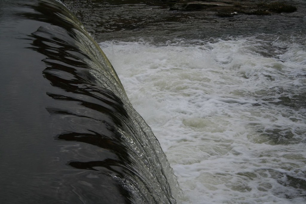 Washed Away Water rushing past the Bridgeton Bridge in Rac… Flickr