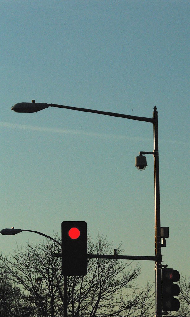 StreetlightMounted Surveillance Camera At Avenue,… Flickr