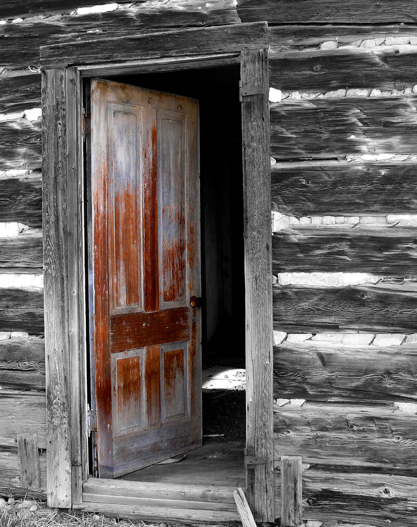 Old Open Door An old door in an abandoned log house. Brad Smith