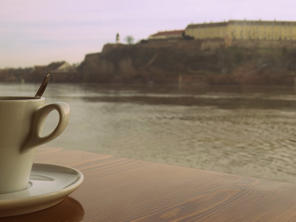 cup of coffee on a boat in front of a beautiful old fortre… Flickr