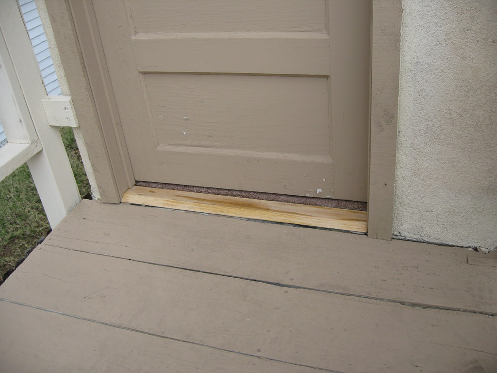 Carpet sticking out under door to second floor room Flickr