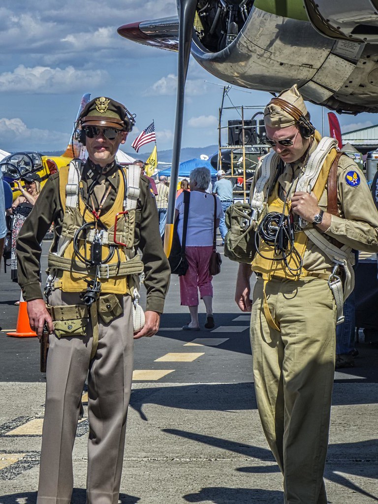 Two WWII reenactors discuss tactics at the 2014 Air Show of the