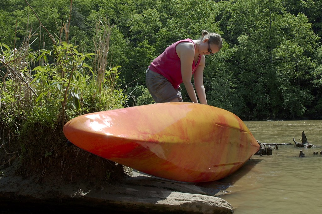Dallas lifts her kayak out of the water Thomas Strömberg Flickr