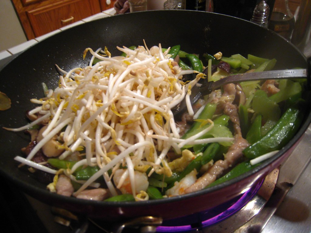 cooking the ingredients bean sprouts, celery, snow peas, s… Flickr