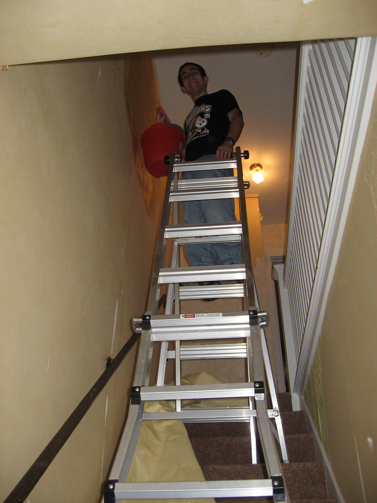 Mountain man Atop the ladder getting wallpaper backing off… Flickr