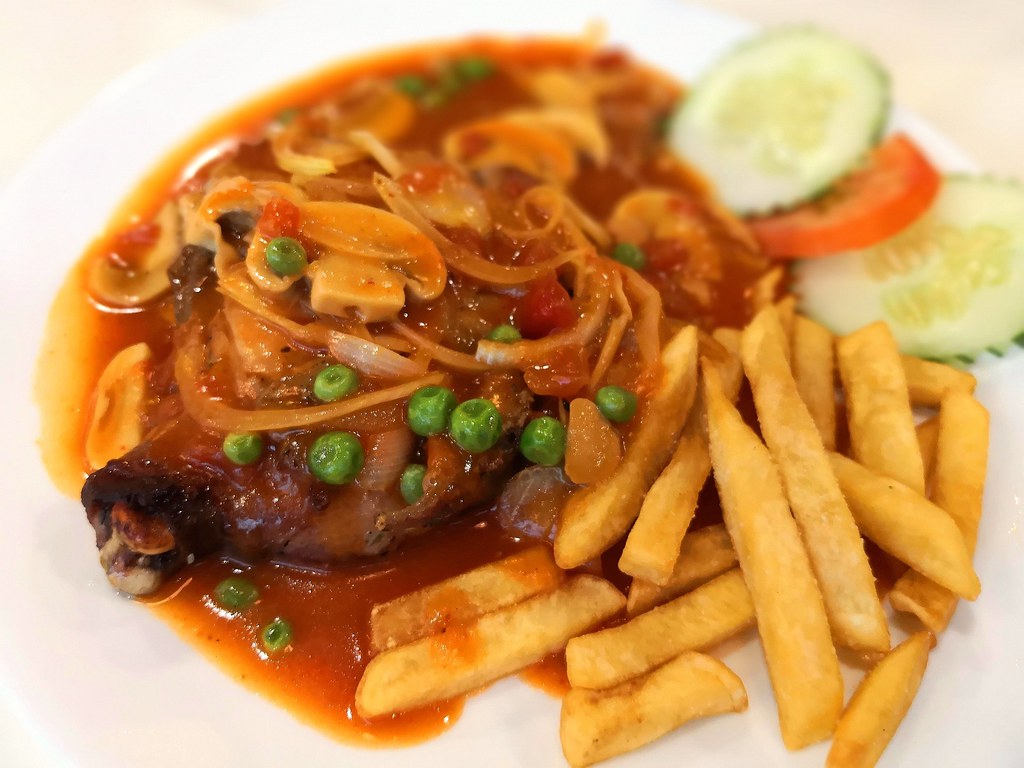 A plate of chicken chop with gravy. I like fried chicken c… Flickr