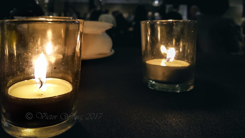 Closeup of a tealight candle burning in shot glass Flickr