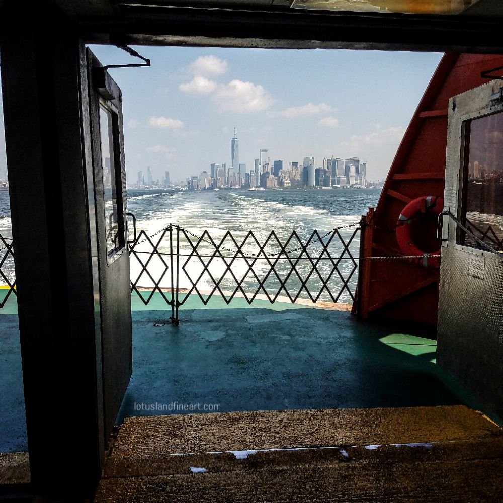 Manhattan is visible through the back doors of the Staten … Flickr