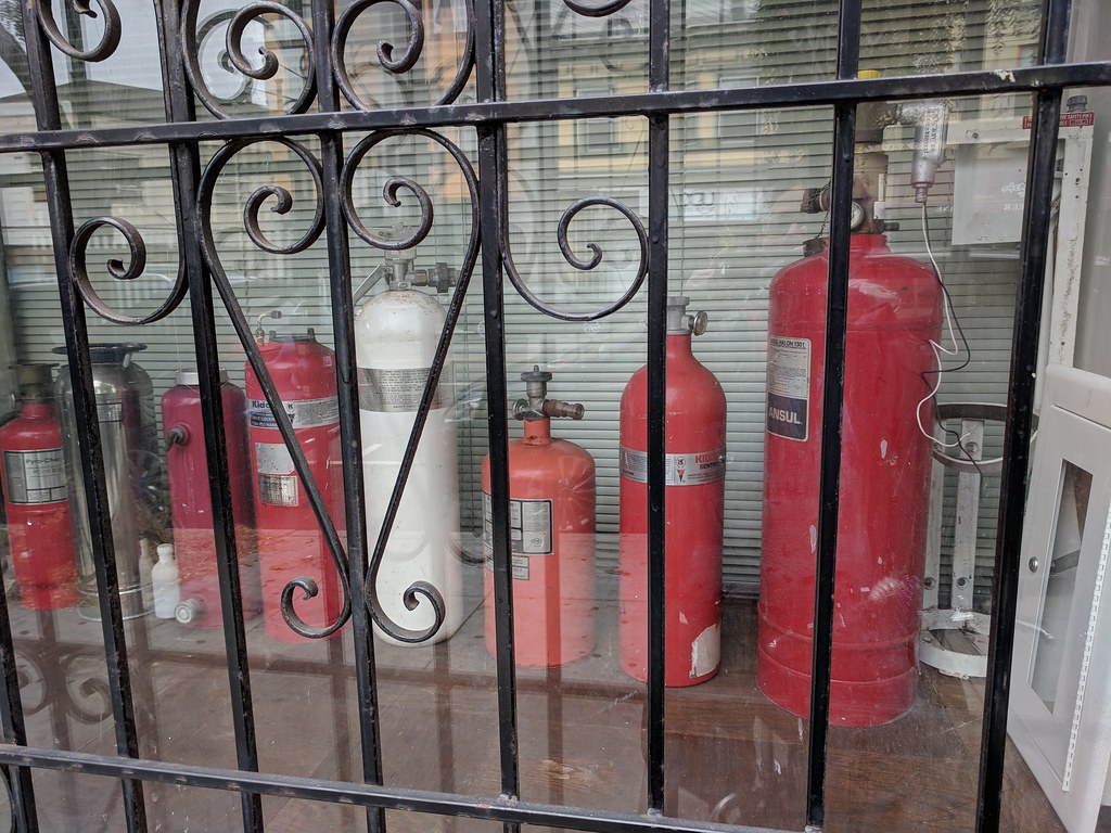 fire extinguishers behind iron grille i can't wait to draw… Flickr