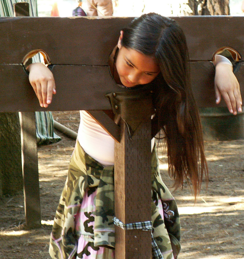 young woman in stocks not a common sight 'round heres My b… Flickr