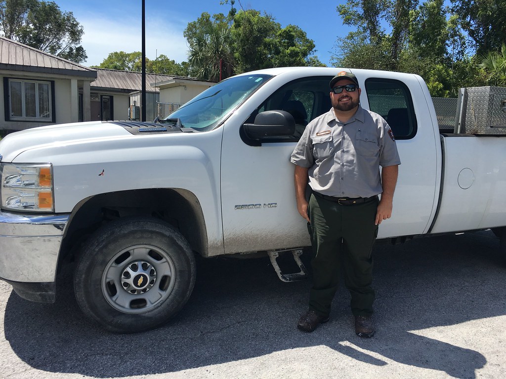 Maintenance Park Ranger next to Work Truck NPS Photo D. Di