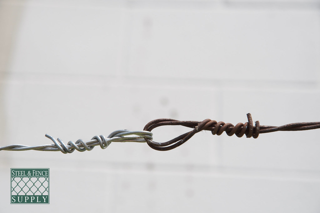 BarbWire_Spliced Rusty and new barbed wire spliced Steel And Fence