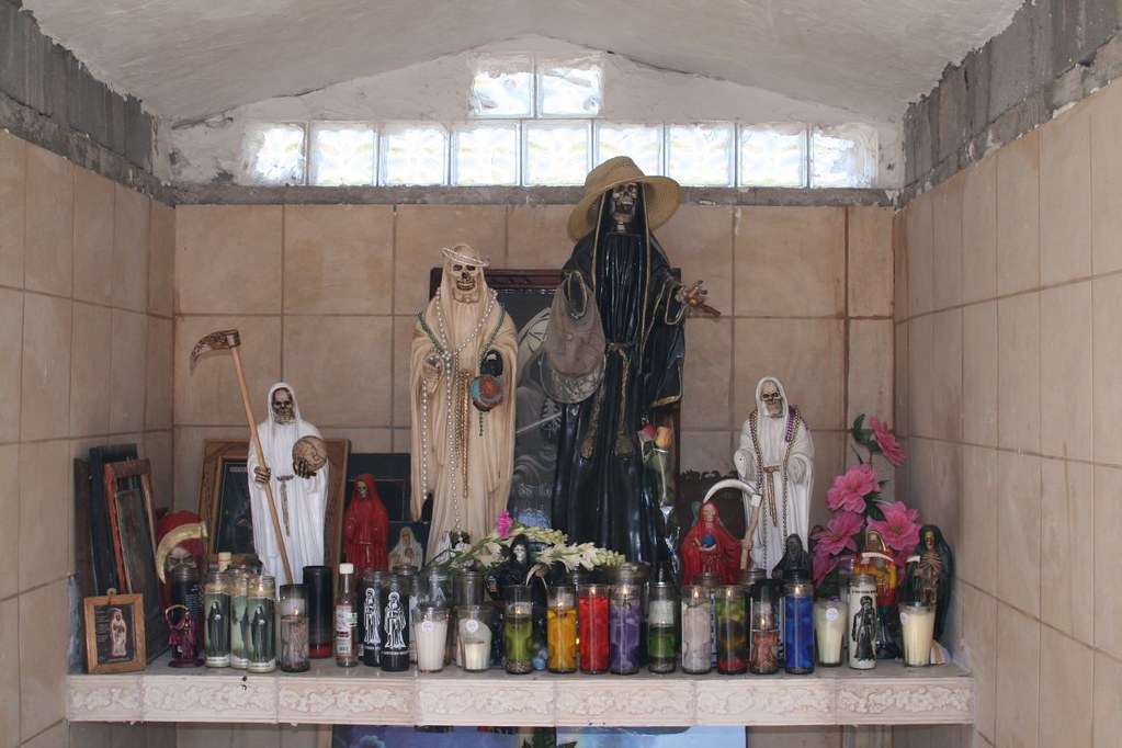 Candles for Saint Death A mexican shrine where people pray… Flickr