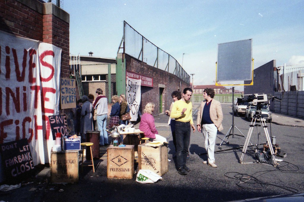 Brookside location Outside the gates at Ogdens factory, Li… Holding