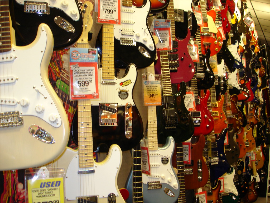 TAKE YOUR PICK Wall of Guitars at the Guitar Center, Dalla… Flickr