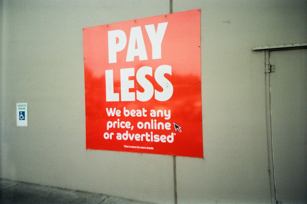 Sign Pay Less, We beat any price, online or advertised Flickr