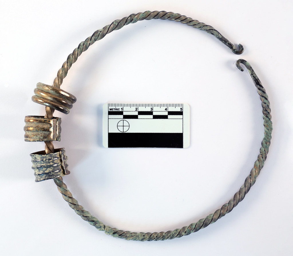 Torc with rings (during cleaning) Bronze Age metalwork fro… Flickr