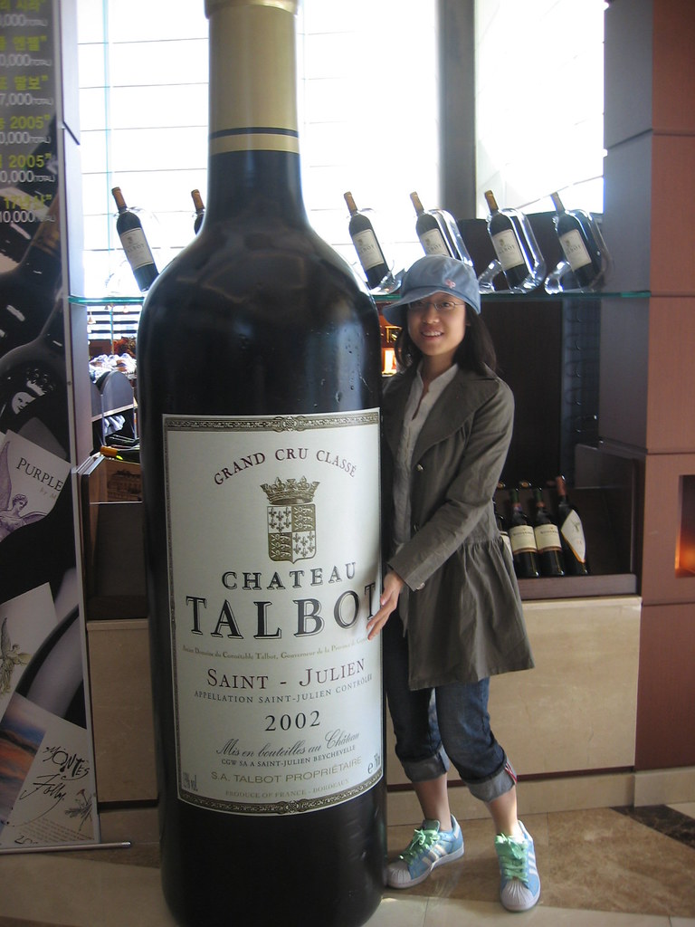With a huge wine bottle. fwcharisma Flickr