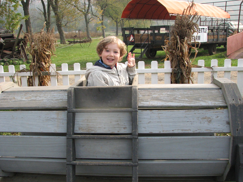 Eli in train car at Iron Kettle Farm Dana.Wardlaw Flickr