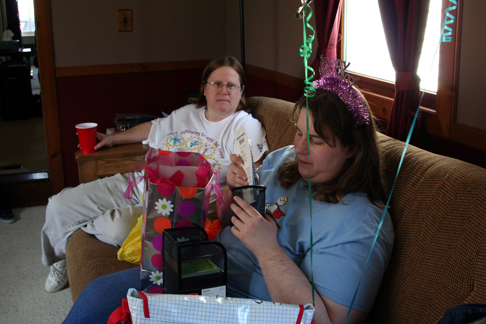 Moe opening presents (while Mary watches) CarrieLu Flickr