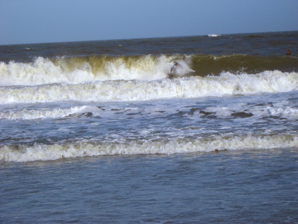 Tybee Island Beach, Surfer takes the waves at