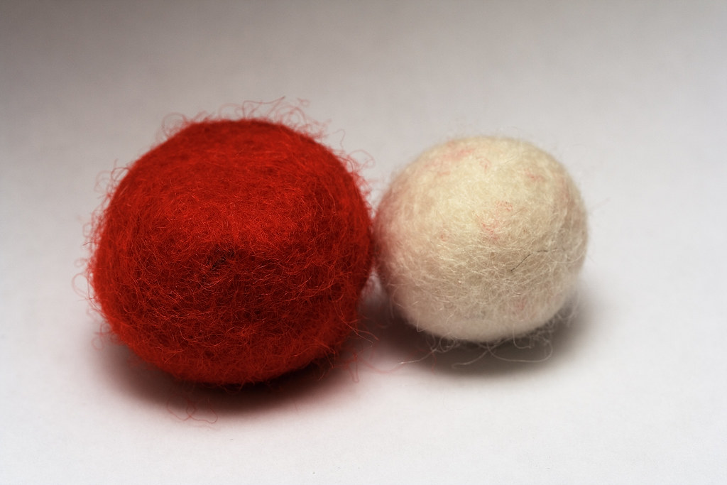 Two balls of felt wool How to make a felt ball 1.Wind wool… Flickr